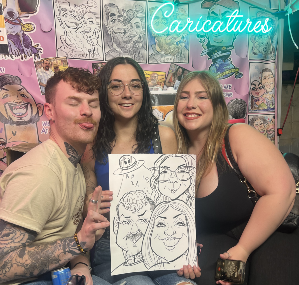 Couple holding a color caricature